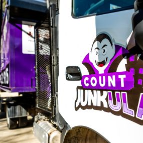 count junkula of raleigh junk removal dumpster logo shot white