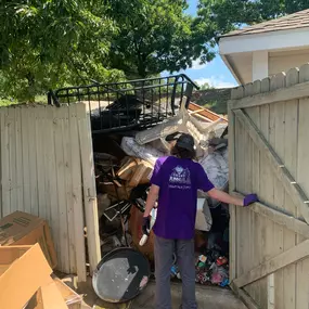 count junkula of raleigh junk removal crew member at work