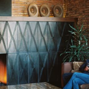 Guests relaxing by the fireplace