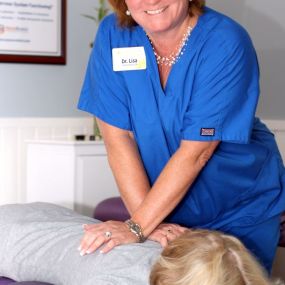 Dr. Lisa Marsh, DC Performing a Chiropractic Adjustment