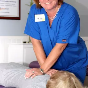 Dr. Lisa Marsh, DC Performing a Chiropractic Adjustment