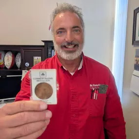 A friend of mine, Judy McLaughlin, worked with State Farm 52 years ago and gave me the 50th year anniversary coin. I am very honored to have received it.