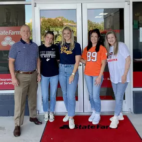 Excited for college football and wearing our team gear at the office!