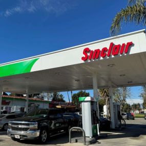 Sinclair gas station canopy and pumps