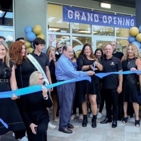 Mayor Greg Ross and the Hair Cuttery team cutting the ribbon at the grand opening in Cooper City, FL.