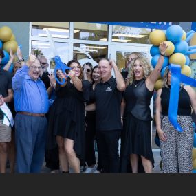 Hair Cuttery team and Mayor Greg Ross cheering at the grand opening in  Cooper City, FL.