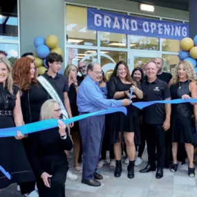 Mayor Greg Ross and the Hair Cuttery team cutting the ribbon at the grand opening in Cooper City, FL.