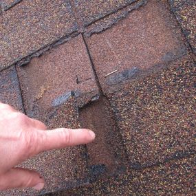 storm damage shingles