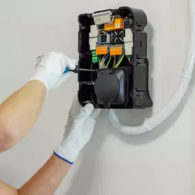 Electrician installing EV charger