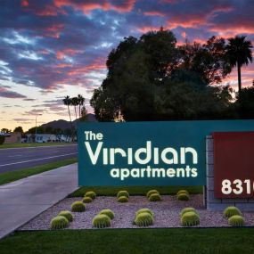 Viridian Apartments Welcome Sign with Manicured Landscaping Surrounding the Small Cacti