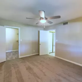Bedroom with Plush Carpeting and a Ceiling Fan