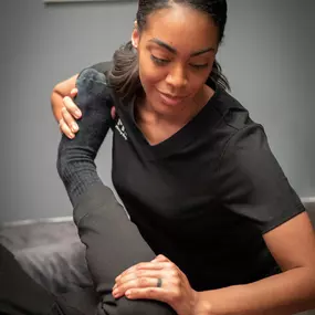 Licensed sports massage therapists can offer relief for injuries with leg stretches