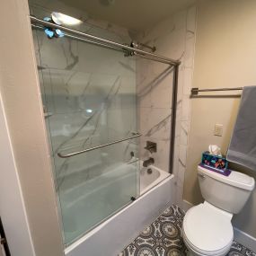 Shower door adjustment