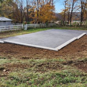 Retaining wall and paved blacktop court