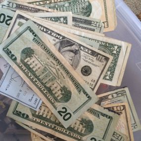 Being organized saves you time and money....sometimes you even find money! This pile of cash and checks were found in a box of clutter we were organizing!