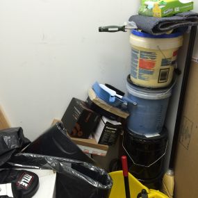 CLUTTERED SUPPLY CLOSET -- BEFORE