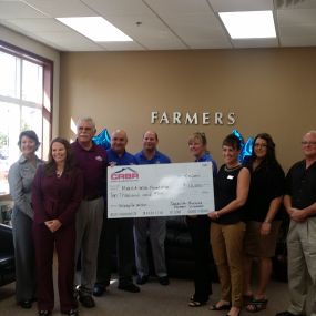 Redding Farmers Insurance and CRBR presenting a check to Make-A-Wish Foundation.