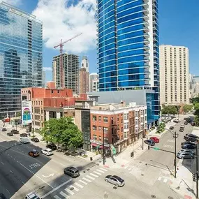 Modern high-rises, historic brick buildings, and a busy intersection in vibrant River North