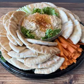 Homemade Hummus, Fresh Vegetables, and Pita Bread.