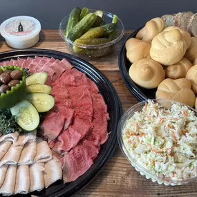 Any combination of (3) Meats, sliced and arranged on a platter. Includes Rye Bread and Rolls, Coleslaw, Mayo, Pickles, Mustard & Russian Dressing.