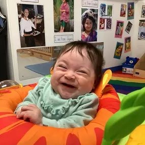 Pure joy! The sound of a giggling infant is a reminder of the happiness found in every little moment.