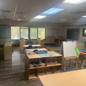 A playful, energetic space designed for older two-year-olds to explore, build social skills, and engage in early learning through guided play and activities.