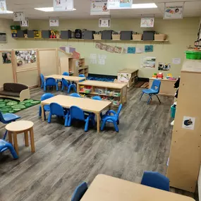 A playful, energetic space designed for older two-year-olds to explore, build social skills, and engage in early learning through guided play and activities.