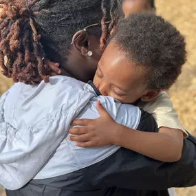 A moment of warmth and connection! Teachers and kids share a sweet hug, strengthening bonds of trust and care.