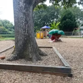 A spacious playground filled with colorful play structures, perfect for adventure and exploration.