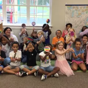 Look what we made! Kids proudly showing off their creative, hand-decorated decotropes.