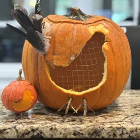 We had some fun with a pumpkin carving contest in our office! Take a look at our creations and see which one got the most likes!