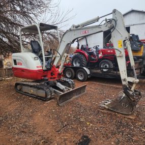 Experience power and precision with the Takeuchi TB230, a compact excavator designed for demanding digging and lifting tasks. Its advanced hydraulics and user-friendly controls make it perfect for construction sites, utility work, and landscaping projects. This excavator ensures top-notch performance for any challenging job.