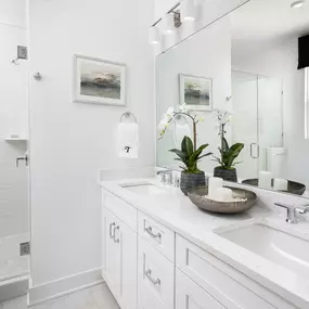 Luxurious primary bathroom suites with dual vanity sinks