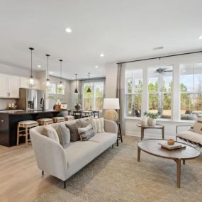 Open-concept floor plans with views of the kitchen, great room, casual dining area, and covered patio beyond