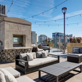 Outdoor fireplace with ample lounge seating.