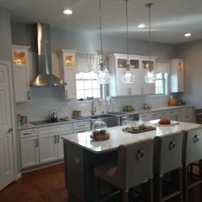 We remodeled this kitchen a few years ago. Love the classic layout, farmhouse faucet and the stainless range hood. Let us help you transform your visions into reality.