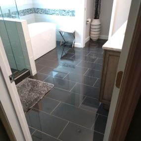 We did this bathroom remodel in 2019. I was particularly happy with the glossy black floor tile. Look at that shine! The project also featured a stand alone tub and a glass enclosed shower. If you have a vision, we can make it a reality. See our website for more ideas.
