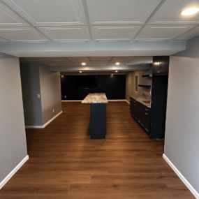 We just finished this complete basement remodel. We started with the framing for a bar, bathroom, office and a bedroom. The added a super cool ceiling grid and tile. It turned out to be a very cool living space. See more photos at our Facebook page.