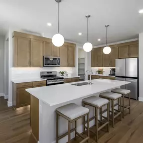 Kitchen with island in Skyridge floor plan offered in new construction homes in Heber City, Utah