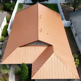 Aerial view of copper-colored metal roofing installation by Armor Roofing—expert roofers near me providing durable, hurricane-resistant metal roofing in Leesburg, Florida.