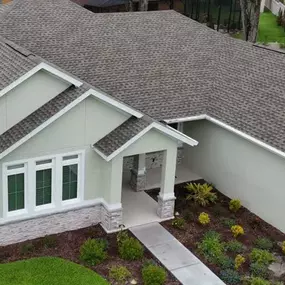 Beautiful gray home featuring dimensional asphalt shingles installed by Armor Roofing—roofers near me offering professional, affordable roofing services across Leesburg.