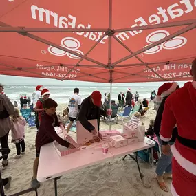 Had the privilege of handing out coffee and donuts to the surfers and surfing Santa! - Ryan Hill State Farm Insurance Agent Palm Bay call for a free quote