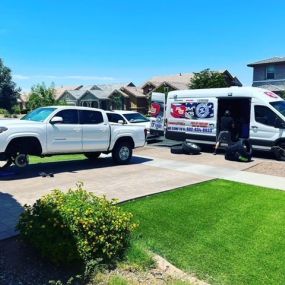 Mobile tire service being provided to a customer outside of their house by Freedom Tire Guys Arizona