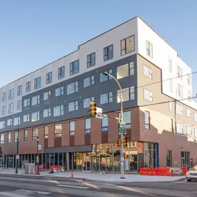 The Gio Apartments present a striking modern façade when viewed from the street.
