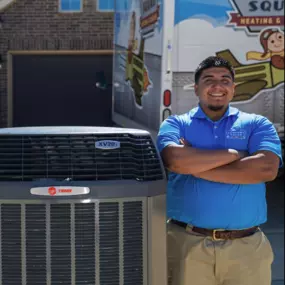 A skilled HVAC contractor stands confidently beside a Trane air conditioning system, showcasing expertise and dedication to quality service. The contractor is dressed professionally, with tools nearby, ready to provide maintenance or installation services. The Trane system gleams with reliability, promising optimal comfort and efficiency for the homeowner's space. The scene exudes competence and assurance, ensuring peace of mind for the customer.