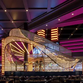 The Glass Bar at Planet Hollywood in Las Vegas offers edgy ombre lighting, ebony-stained wood, opulent brass, and gold-hued marble envelope you in a comfortable, yet elegant lounge experience.