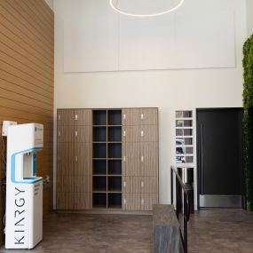 The lobby of KINRGY Studios WeHo, showing lockers and the entrance to the practice room.