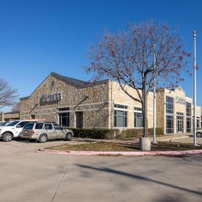 This is a picture showing the South and East exterior sides of the CUTX branch in Garland, Texas.