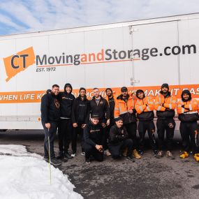 CT Moving and Storage team standing outside with one of our trucks
