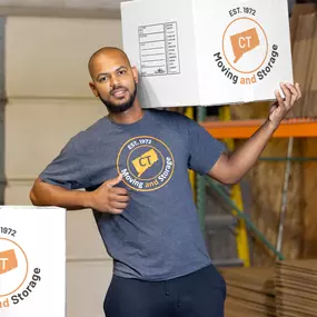 CT Moving and Storage Team member with boxes